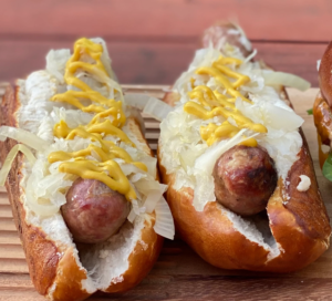 Hot dogs on pretzel buns with Kraut and Mustard